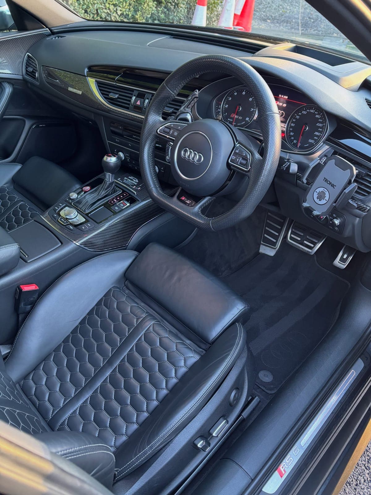 Audi RS6 interior with honeycomb stitched leather seats, steering wheel and carbon trim after a clean