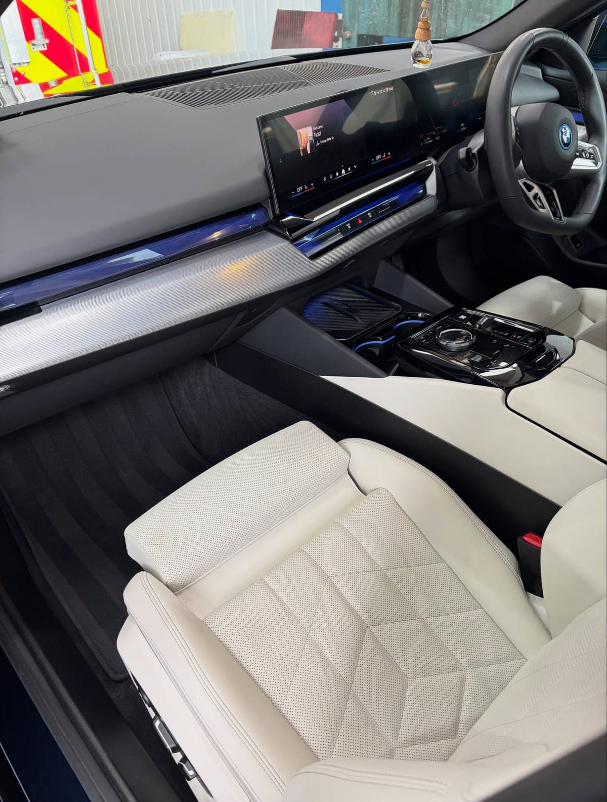 Cream leather front seats of a BMW 530e after an interior clean
