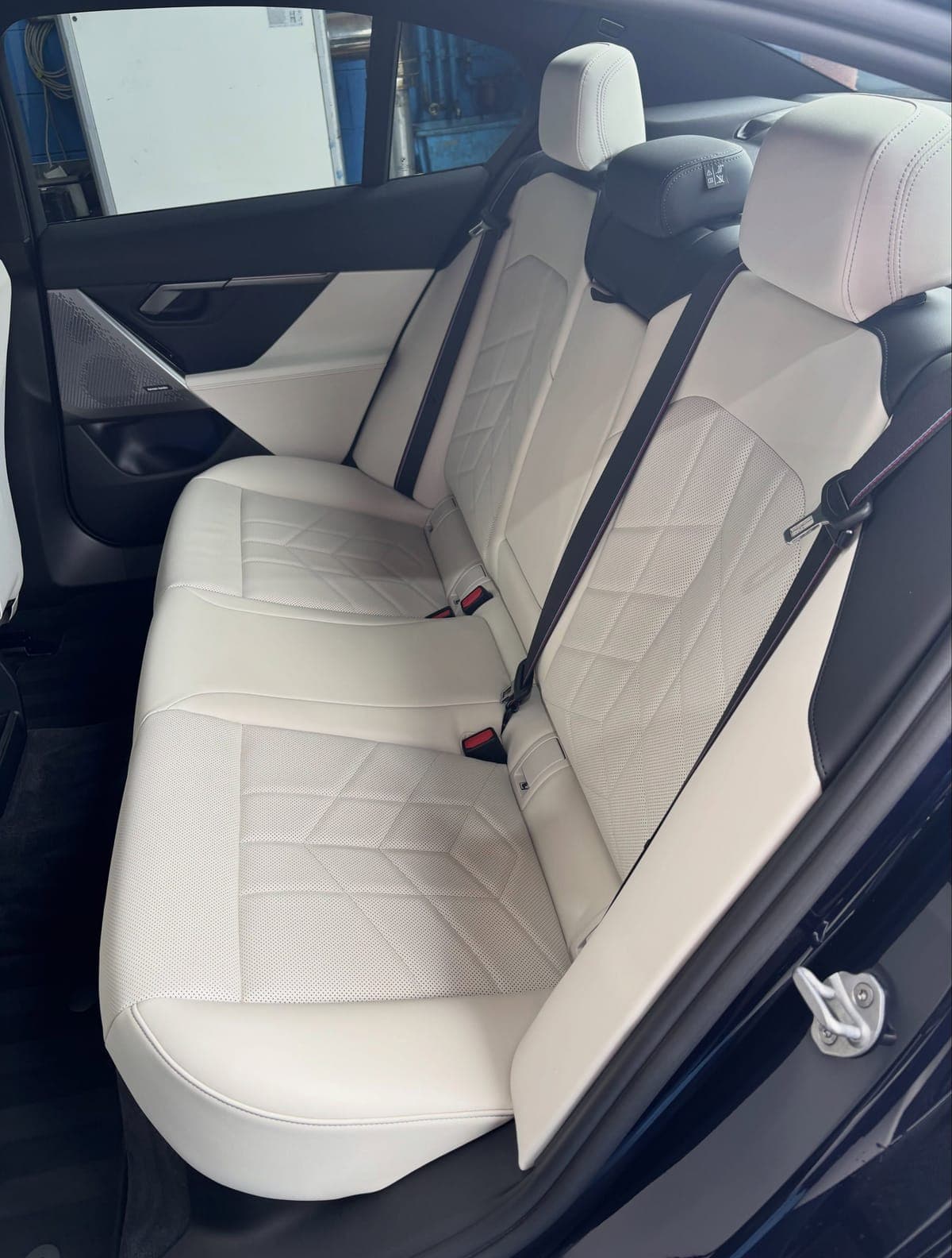Cream leather rear seats of a BMW 530e after an interior clean